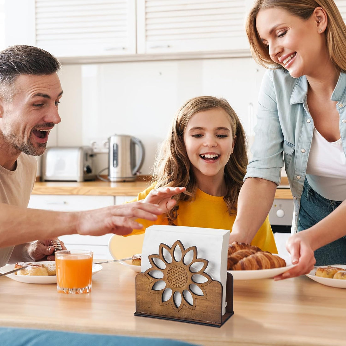 Family at breakfast with the sunflower napkin holder on the kitchen table